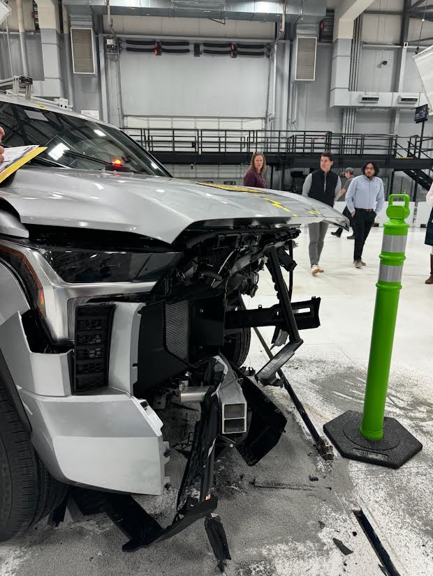 front of a pickup truck destroyed after a crash test.